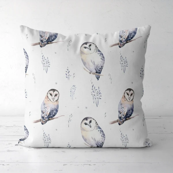 White watercolor owl pillow standing on a white floor, front view