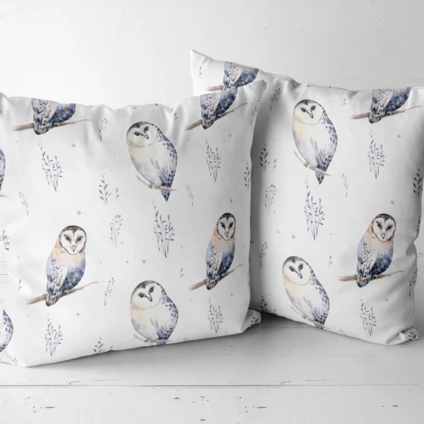 Two white watercolor owl throw pillows side by side