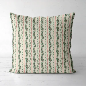 Winding berry vine Christmas pillow seen from the front, green vines on cream