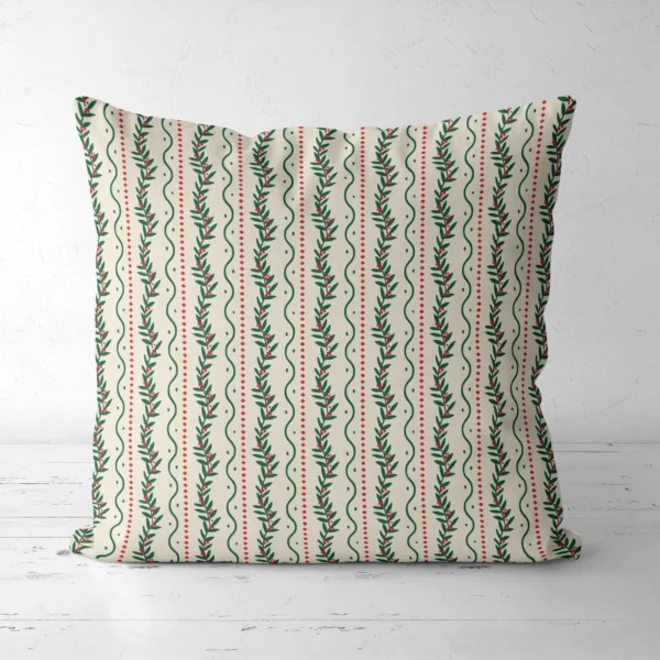 Winding berry vine Christmas pillow seen from the front, green vines on cream